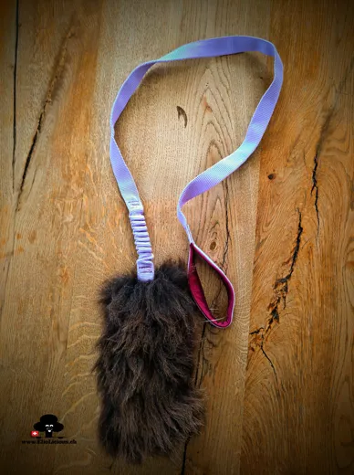Sheepskin brown fur tug toy with bungee handle on long webbing