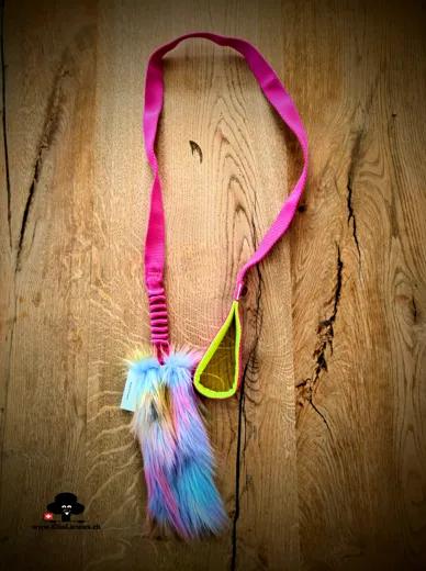 Faux fur rainbow tug toy with bungee handle on long webbing fuchsia