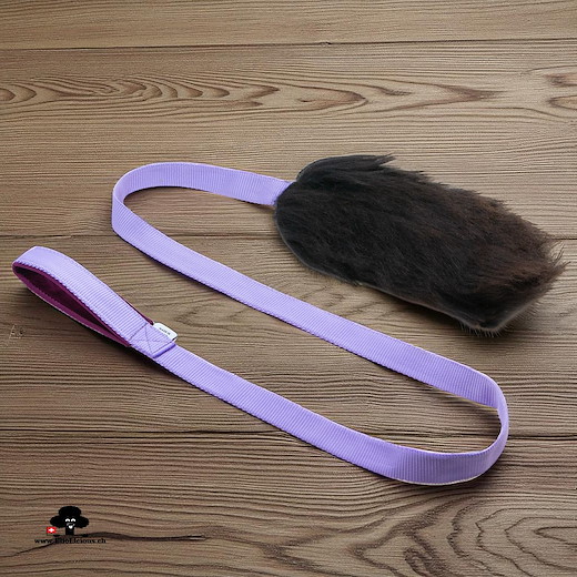 Sheepskin brown fur tug toy with handle on long webbing
